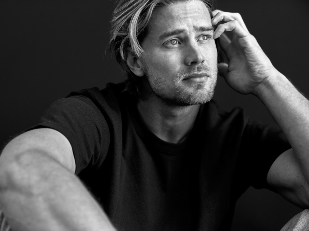 Black and white portrait of young blonde man