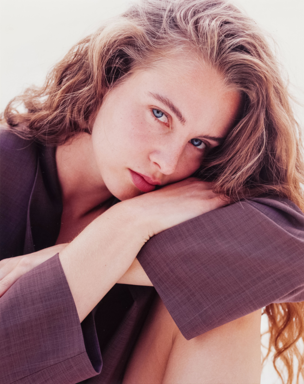 Portrait of a young woman wearing purple blazer