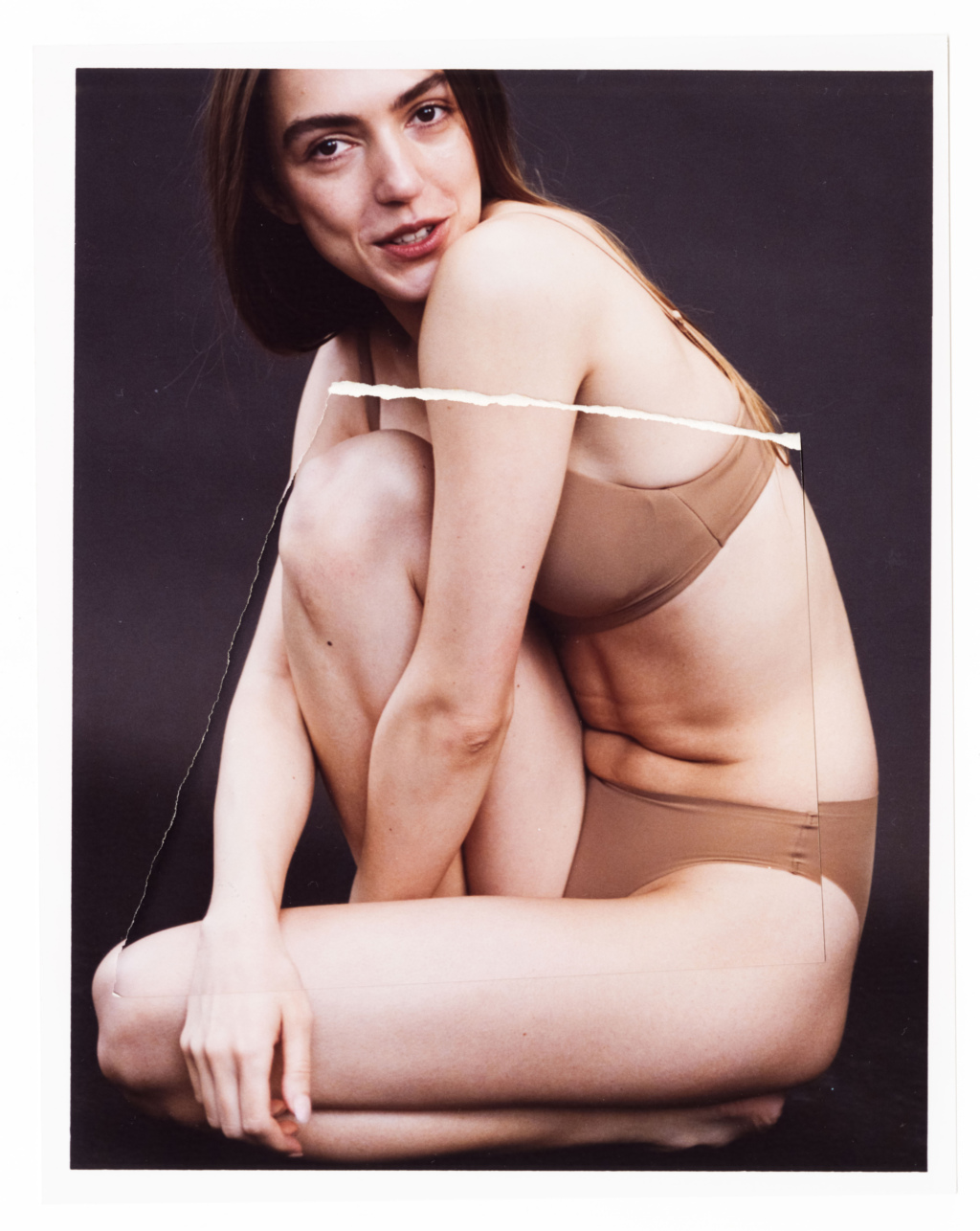 Print of a woman sitting with detail print of her torso superimposed