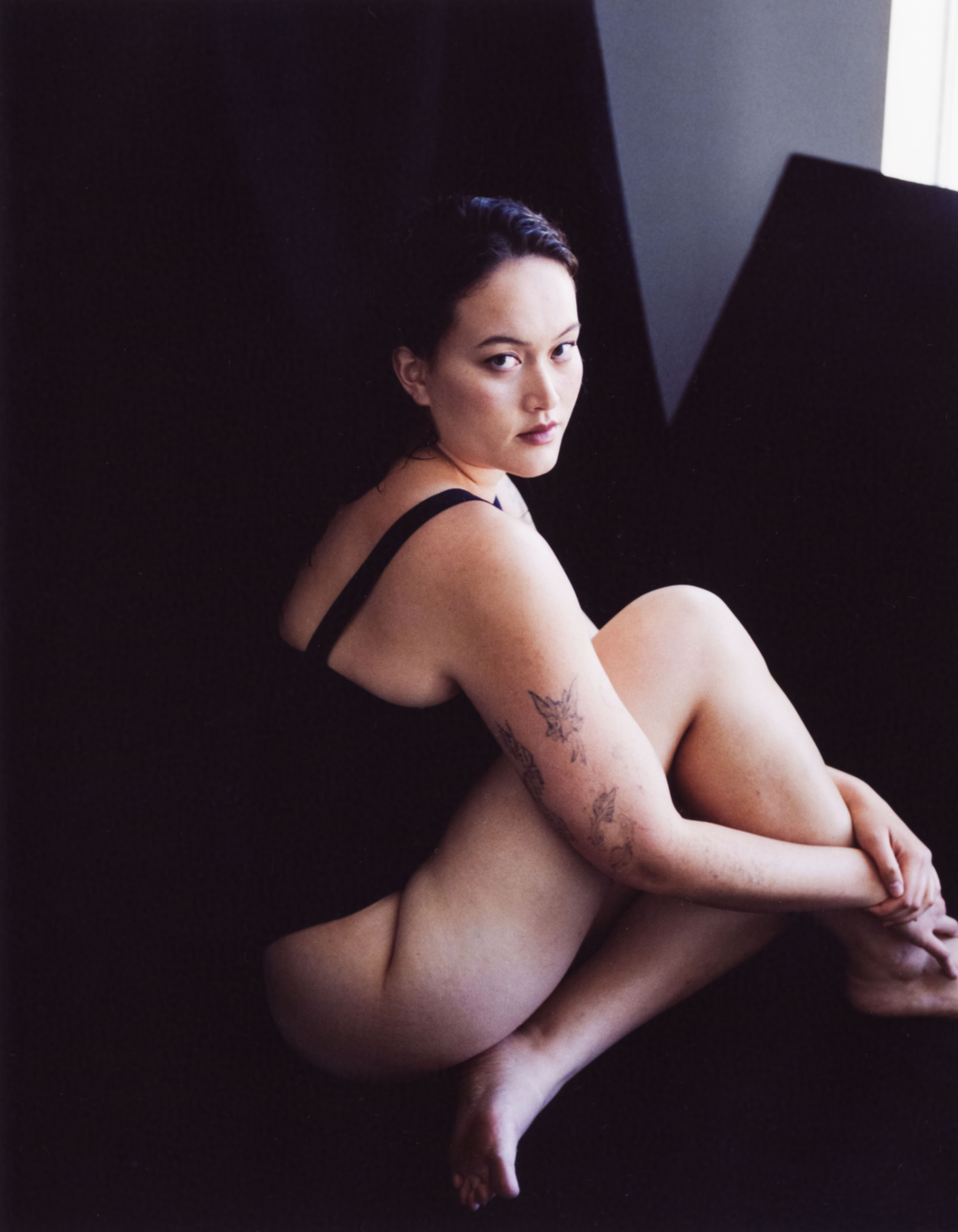 Portrait of a young woman sitting down
