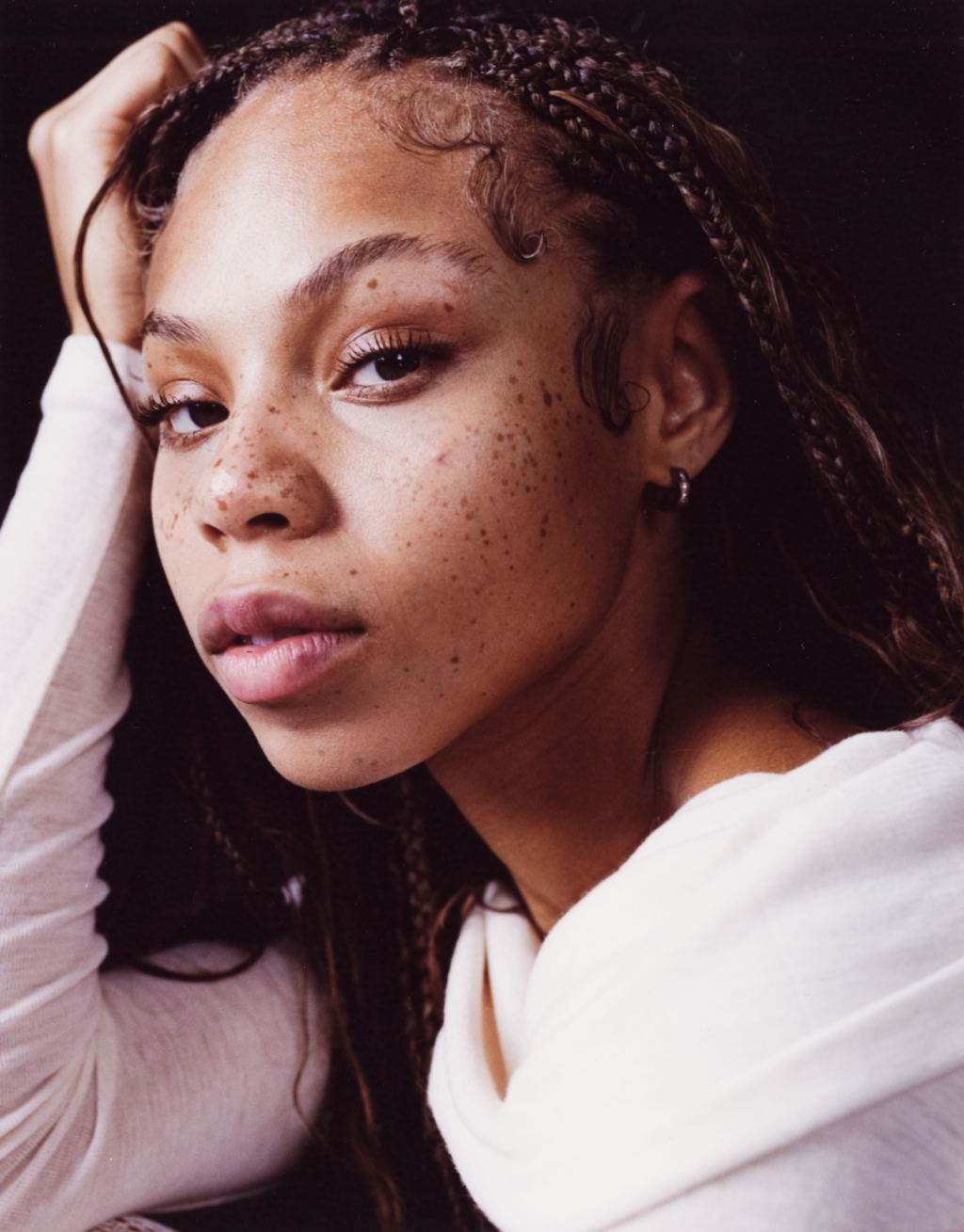 Portrait of a young woman with braids